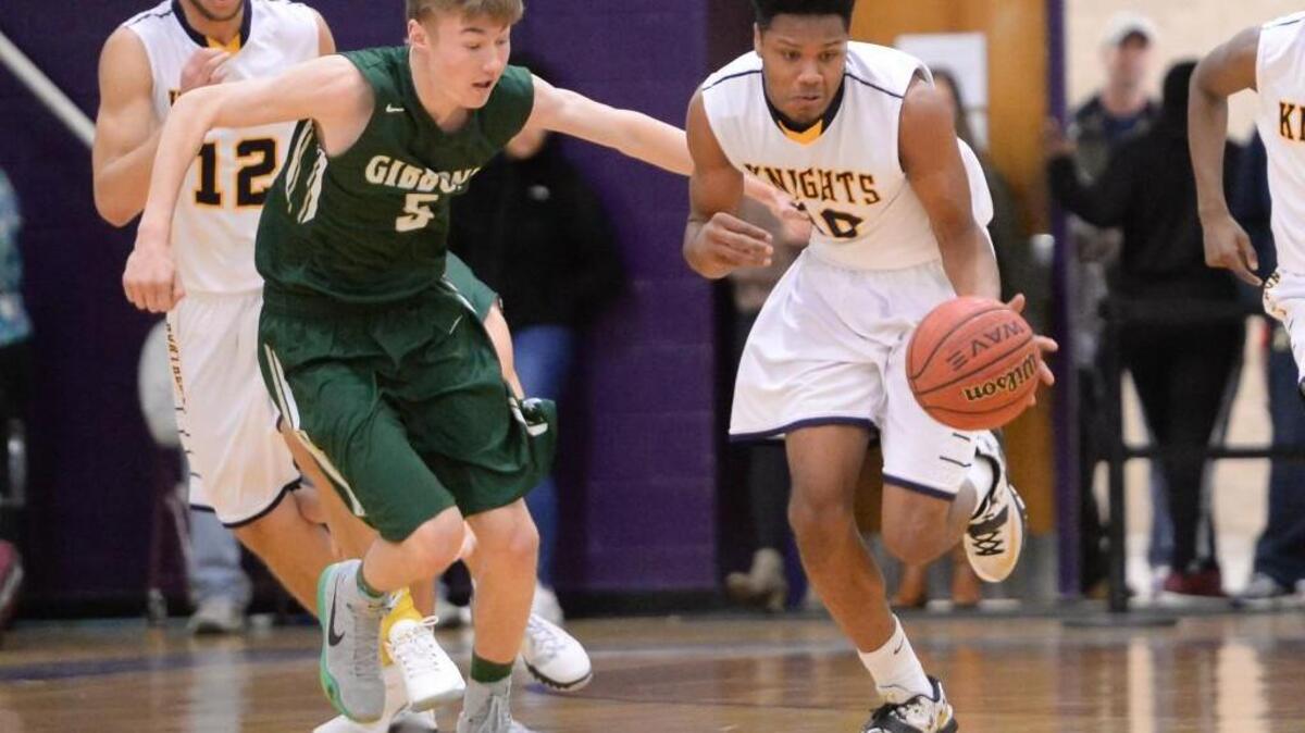 Eric Stokes (10) of Northern brings the ball upcourt against Mike Brannan (5) of Cardinal Gibbons. The Cardinal Gibbons Crusaders played the Northern Knights in Durham, N.C. on Friday, February 19, 2016. Northern won 54-45.