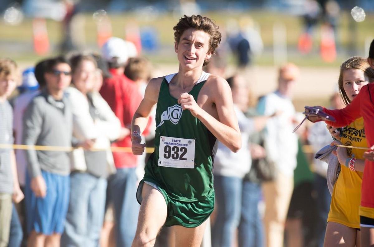 Cardinal Gibbons' Connor Lane comes around the final turn to win the NCHSAA Class 4A Boys State Cross Country Championships that took place at Ivey Redmon Sports Complex on November 5, 2016 in Kernersville, North Carolina.