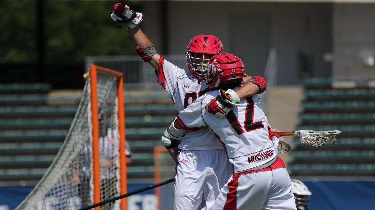 Middle Creek's Charlie Doetzer (99) celebrates with Tanner Patrick (12) after a score during the Middle Creek Mustangs high school Lacrosse match with the Lake Norman Wildcats high school in the State Championship 4A-game in Cary N.C. on May 20, 2017. Middle Creek won the game 17-8.