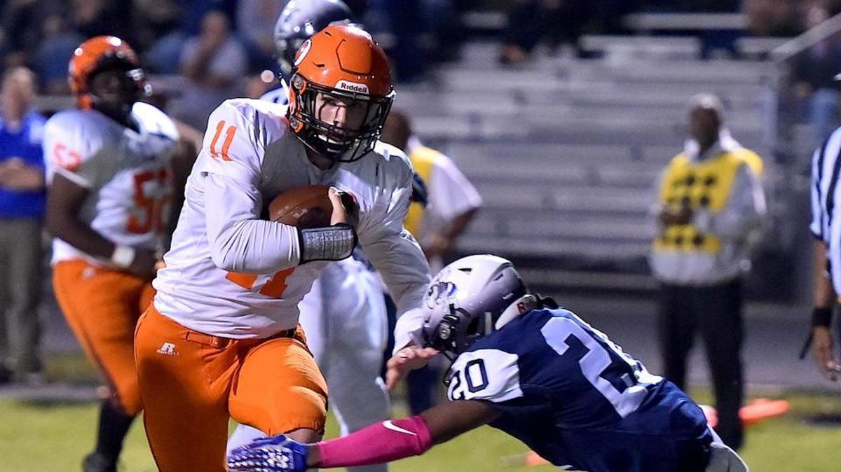 Orange's Payton Wilson (11) runs the ball in for the touchdown while defended by Hillside's Chris Rogers (20). The Orange Panthers visited the Hillside Hornets in a high school football game on Oct. 13, 2017. Orange wins 31-20.