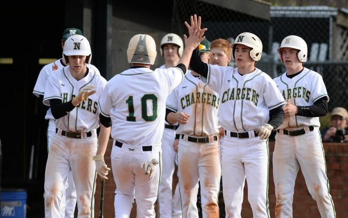 Patrick Szczypinksi (10) of Northwood celebrates along his teammates after scoring during the 4th inning. The Northwood Chargers played the Cedar Ridge Red Wolves in a baseball game that took place in Chapel Hill, N.C. on Friday, April 7 2017. Northwood won 9-2.