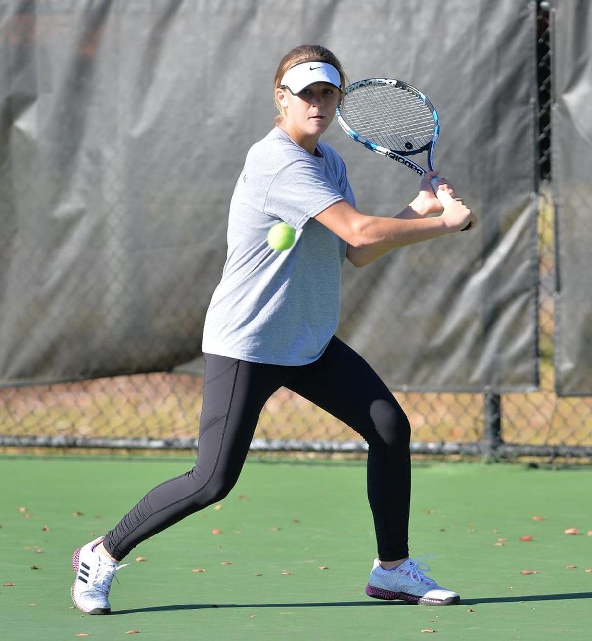 Hailee Haymore of Union Pines hits a return during the women dual team tennis games between the Union Pines Vikings and the Marvin Ridge Mavericks that took place at the Burlington Tennis Center in Burlington, N.C. on Saturday, November 12, 2016.