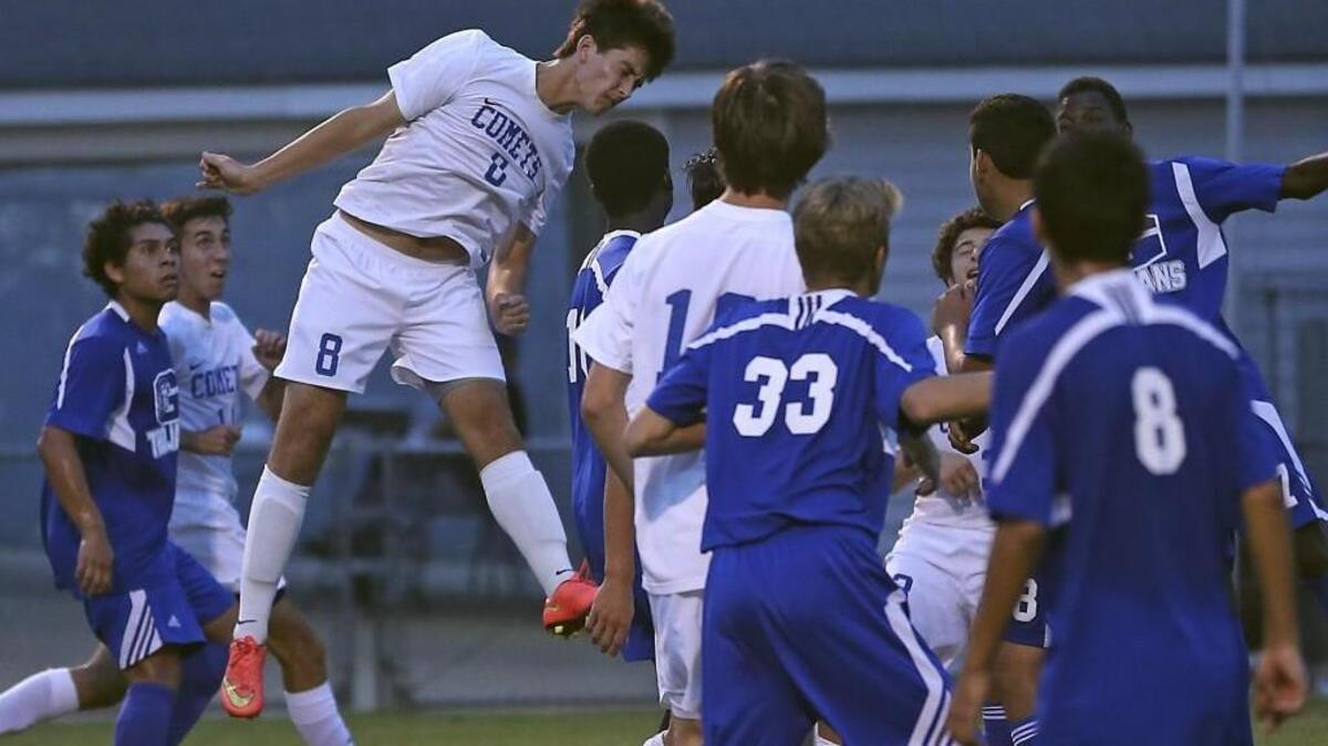 Clayton’s Seth Pope (8) heads a ball toward goal just before the half in the Comets’ 4-1 win over Garner.