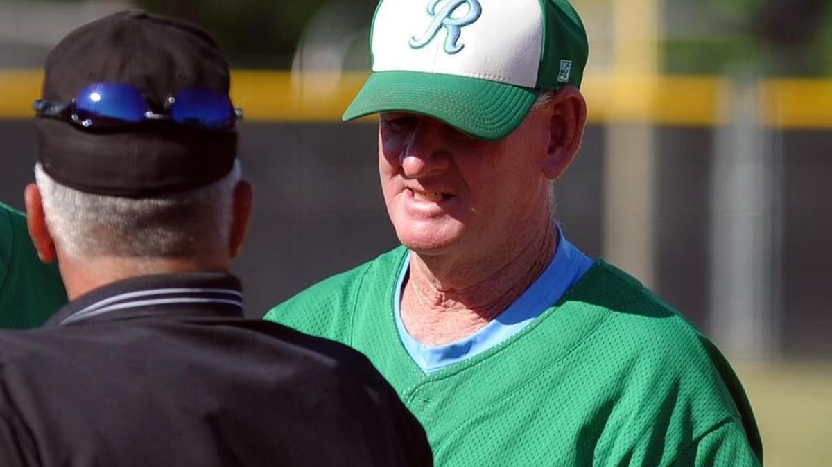 J.H. Rose coach Ronald Vincent shakes hands with the umpire before the NCHSAA third round baseball game against Cardinal Gibbons, which was played in Raleigh on Saturday, May 14, 2016. J.H. Rose won 5-4.