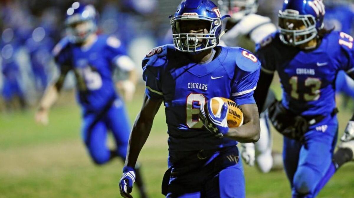 Wake Forest's Marquis Dunn (6) breaks out for a 59 yard touchdown run to get the Cougars on the board with 4:33 left in the first half during the 3rd round of the NCHSAA football playoffs between the Wake Forest Cougars and the Heritage Huskies played in Wake Forest, N.C. on Friday, December 2, 2016. Wake Forest defeated Heritage 35-20 to advance the Eastern Regionals game slated to be played on Friday, December 9, 2016.