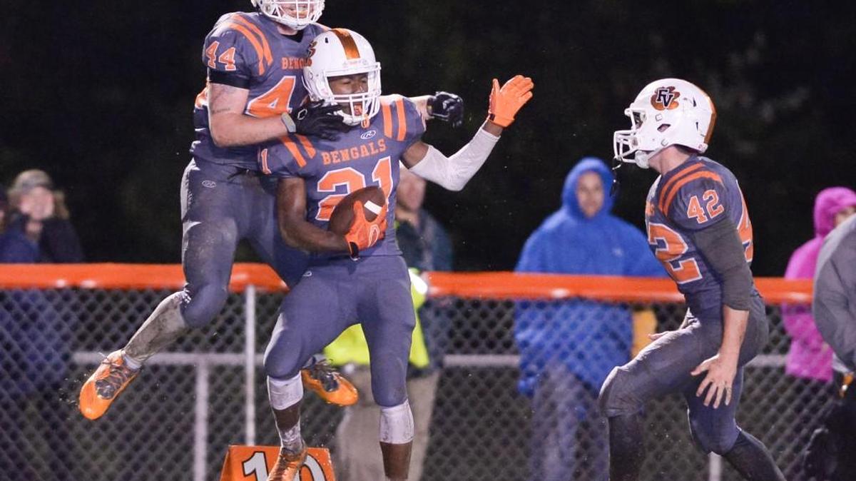
Austin Pluckhorn (44), Mo Bagley (21) and Camden Renfroe (42) of Fuquay-Varina celebrate an interception during the fourth quarter. The Fuquay-Varina Bengals played the Holly Springs Golden Hawks in Fuquay-Varina, N.C. on Thursday, October 1, 2015. Fuquay-Varina won 16-8.
