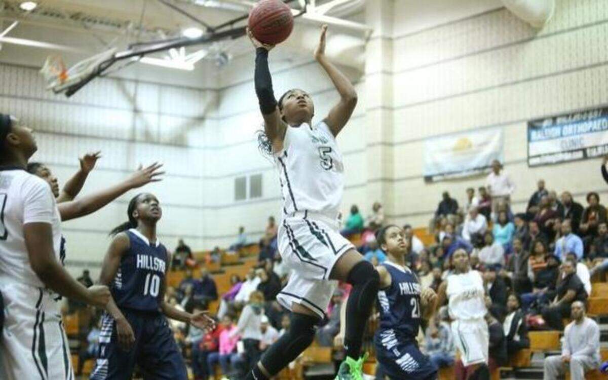 
Southeast Raleigh’s Jade Phillips drives against Durham Hillside during a March 3 playoff game in Raleigh. Phillips, a 6-foot Syracuse recruit, averages 16 points and 10 rebounds. 
