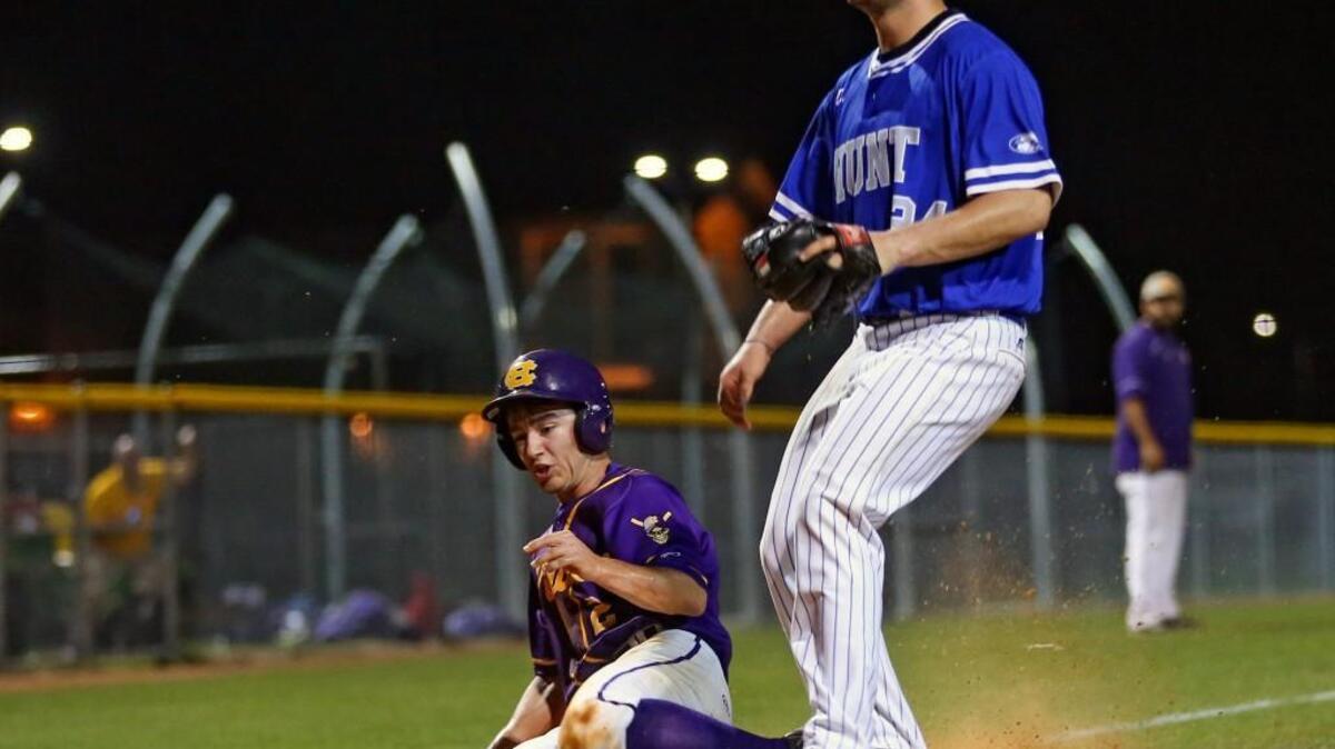 Corinth Holders' Eli Dalton (2) scores the go-ahead run in the bottom of the 6th inning after getting on an error after a dropped third strike and making his way around the bases. Coverage of the prep baseball game between the Corinth Holders Pirates and the Wilson Hunt Warriors played in Archer Lodge, N.C. on Wednesday, March 16, 2016. Corinth Holders scored a run in the bottom of the 6th and went on win 1-0.
