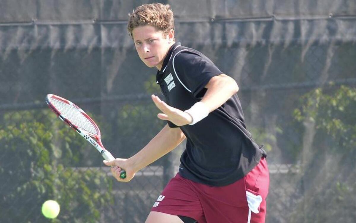 
Bo Boyden of Wakefield hits a ball against Hardy Brown of Page. The Wakefield Wolverines played the Page Pirates in the final dual team men tennis match for the 4A NCSHAA State Championship in Burlington, N.C. on Saturday, May 16, 2015. Wakefield won 5-1.
