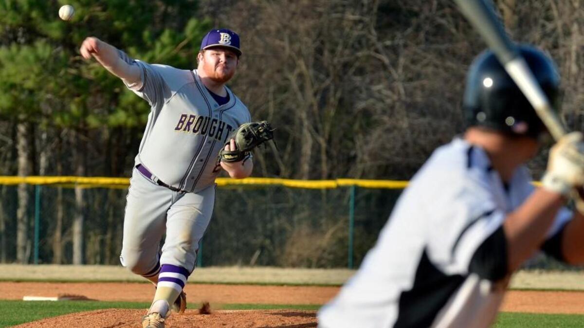 Broughton’s Cam Epperson hurls a pitch off the mound during the Capitals’ baseball game against at Knightdale High School Thursday, March 10, 2016.