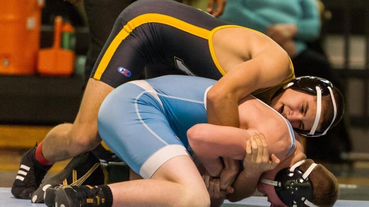 Apex High School's Nick Kliewer wrestles Panther Creek's Kyle Sorensen in the 152 lb weight class during a wrestling match between the Apex High School Cougars and the Panther Creek Catamounts at Panther Creek High School in Cary, NC on Thursday, January 21.