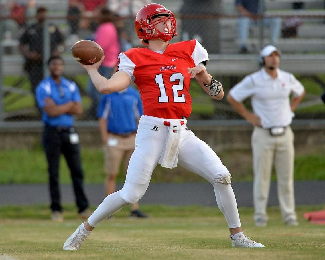 Jordan quarterback Ben Miller (12) prepares to launch the long pass during the first quarter. The Jordan Falcons took on the Chapel Hill Tigers in Durham, N.C. on September 8, 2017. Jordan wins 52-19.