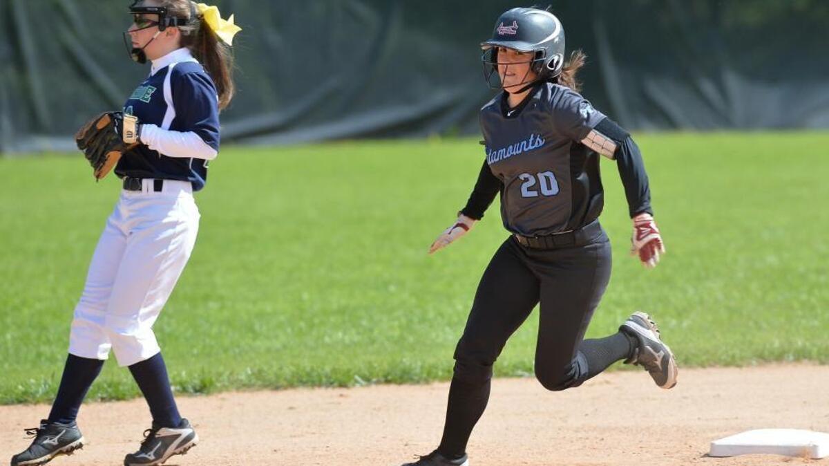 Caroline Zuber (20) of Panther Creek steps on to the second base against Catalina Torrendell, left, of Leesville Road. The Leesville Road Pride played the Panther Creek Catamounts in a softball game that took place in Raleigh, N.C. on Saturday, April 9, 2016. Panther Creek won 15-5.