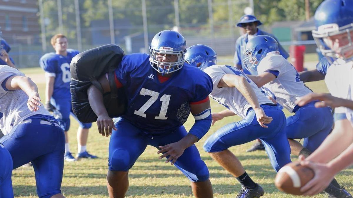 Dexter Lawrence (71) penetrates the line at Wake Forest HS football practice on August 13, 2015. Dexter is the #1-ranked player in the nation, a 6-foot-4, 330-pound defensive lineman.