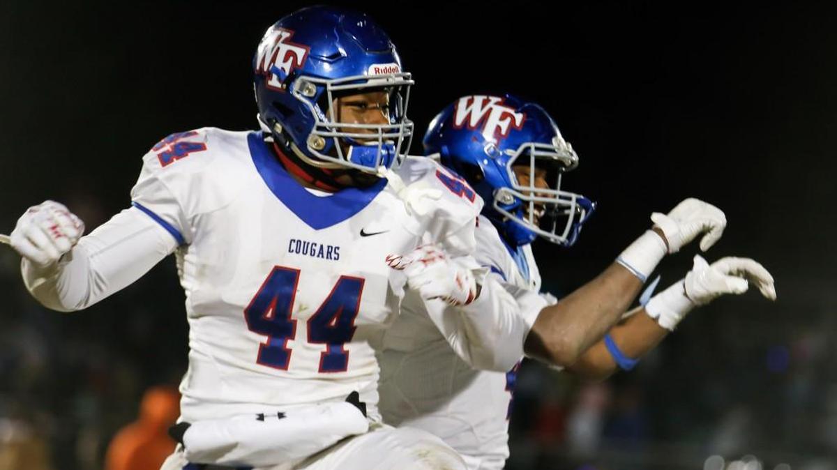Wake Forest's Darius Hodge (44) and Delante Lucas celebrate following Wake Forest's semi-final playoff game at Middle Creek on Friday, December 9, 2016. Wake Forest won the game 20-17 in overtime, and will play in the 4AA state championship.