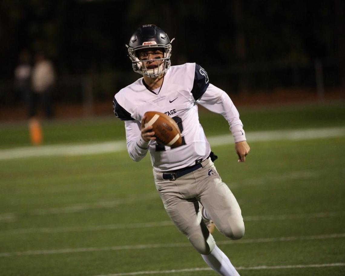 Heritage's Gunnar Holmberg (12) runs in open field .The Cardinal Gibbons Crusaders football team has a home 2nd round playoff game vs. Heritage Huskies on Friday, November 17, 2017. Raleigh ,N.C.