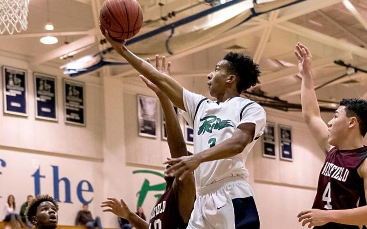 Leesville Road guard Alex Hunter #3 lays the ball up as the Wakefield High School Wolverines took on the Leesville Road High School Pride at Leesville Road High School in Raleigh, NC on Friday, January 15.