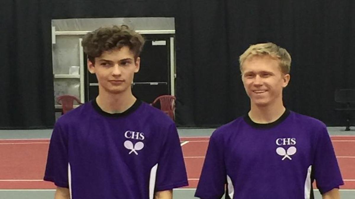 Carrboro's Jason Wykoff, right, and Andre Javen, left, pose with the 2A doubles runner-up trophies at the NCHSAA individual boys tennis championships at N.C. State on May 13, 2017.