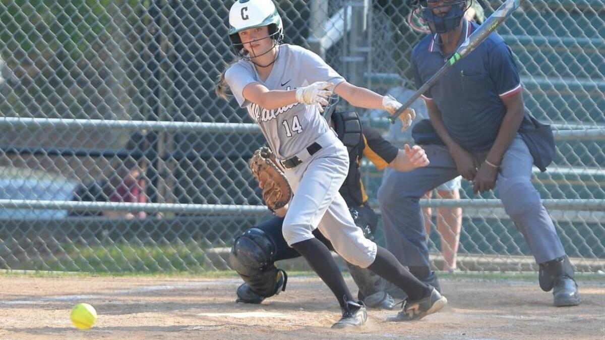 Violet Kehoe (14) of East Chapel Hill hits for a single. The East Chapel Hill Wildcats played the Chapel Hill Tigers in a softball game that took place in Chapel Hill, N.C. on Wednesday, April 20, 2016. East Chapel Hill won 10-0.