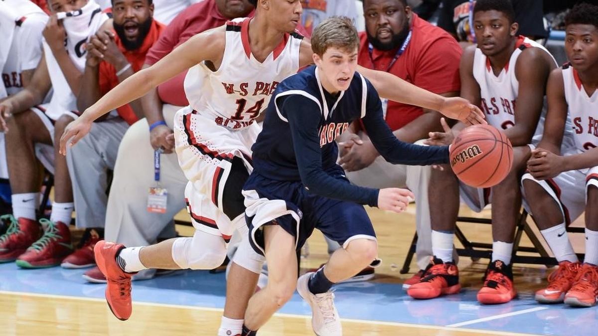 Chance Greene, right, of Voyager dribbles the ball against Chaz Gwyn (14) of Winston-Salem Prep The Voyager Vikings played the Winston-Salem Prep Phoenix in the NCHSAA 1A boys basketball championship that took place at Carmichael Arena in Chapel Hill, N.C. on Saturday, March 12, 2016. Voyager won 69-56. Voyager Academy is a charter school in Durham. Winston-Salem Prep is a public magnet school.