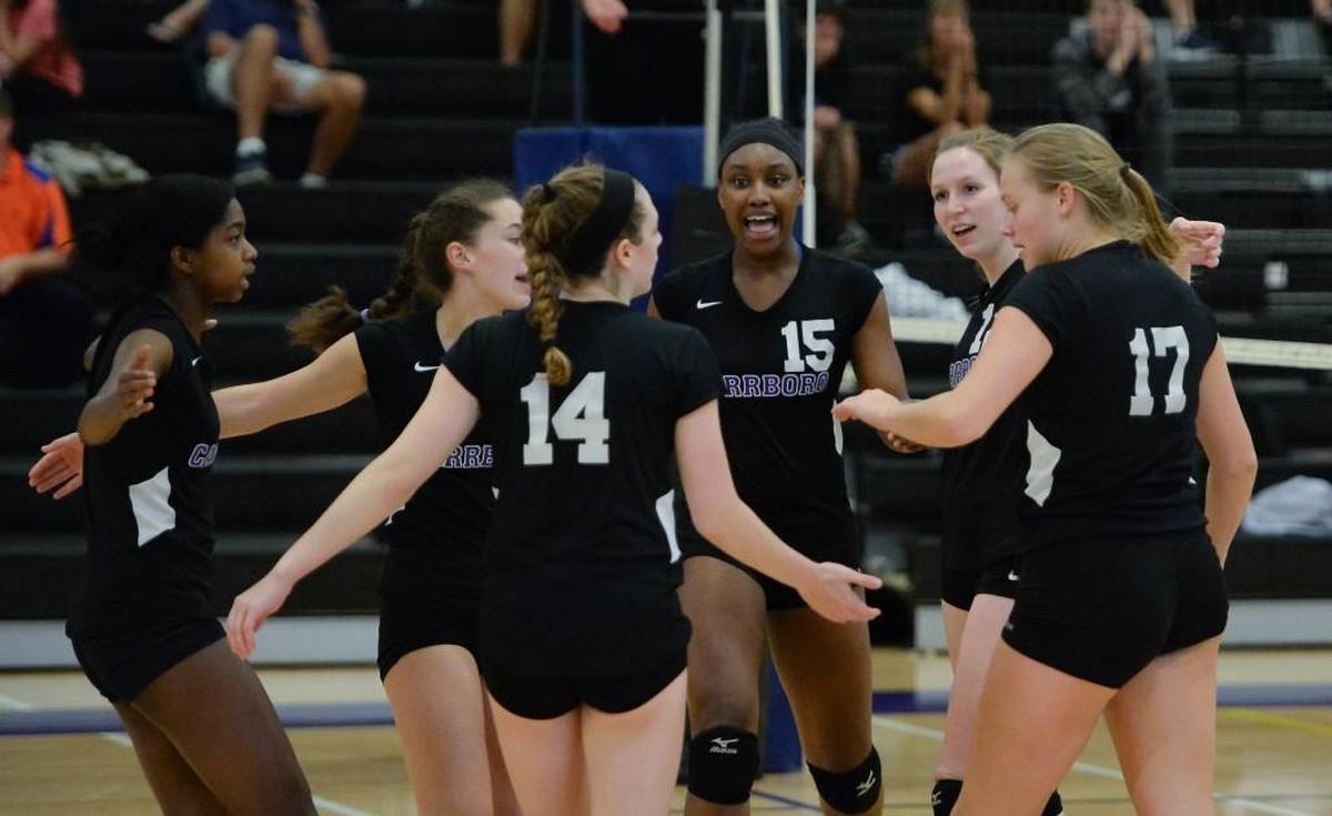 Destiny Cox (15) of Carrboro celebrates a point along her teammates. The Carrboro Jaguars played the Bartlett Yancey Buccaneers in a volleyball match that took place in Carrboro, N.C. on Wednesday, October 19, 2016. Carrboro won 3-0.