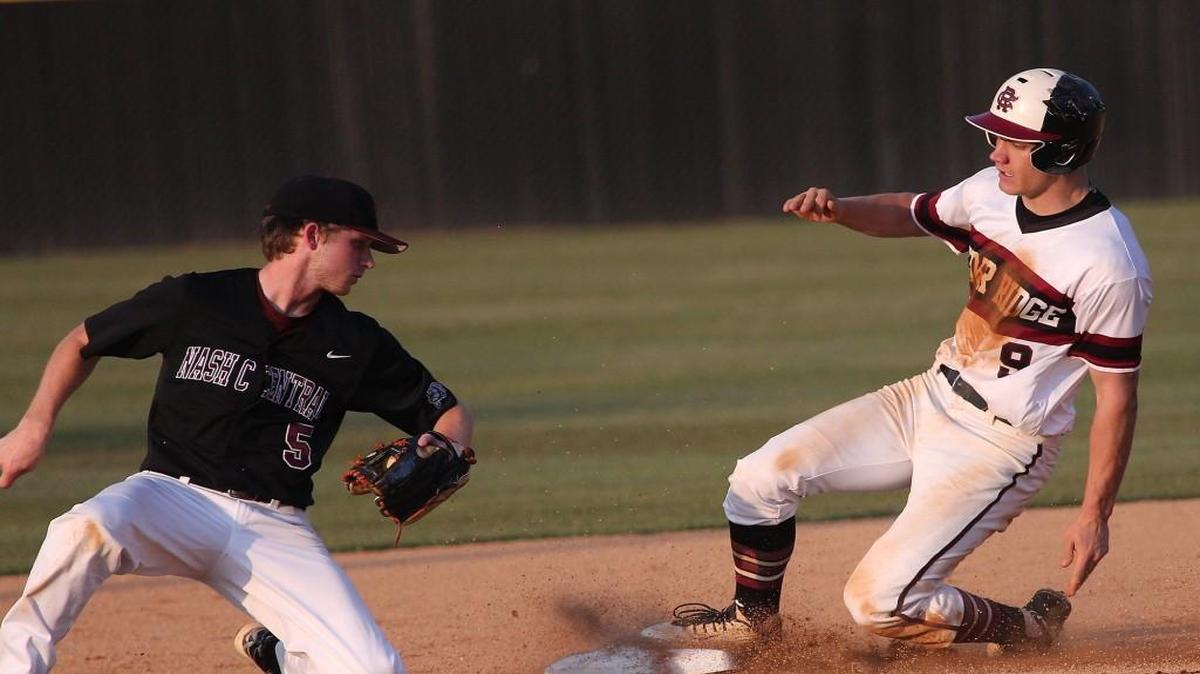 Nash Central's Hunter Robinson (5) tags to late as Cedar Ridge's Adam Chnupa (9) slides into second during the Cedar Ridge Red Wolves baseball game with the Nash Central Bulldogs at Cedar Ridge high on May 10, 2017. Cedar Ridge won the game 4-1.