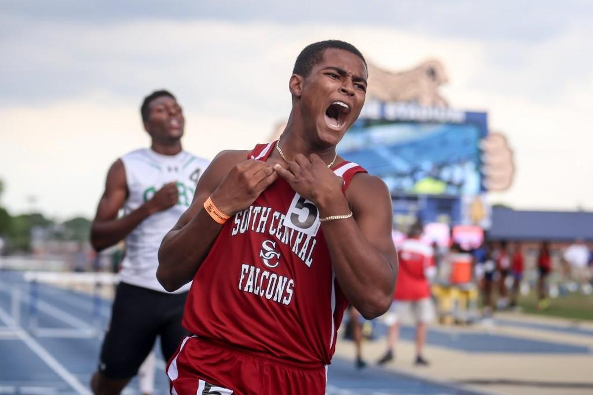 South Central's Dexter McDuffie screams in elation after finishing first in the 300 meter hurdles, just ahead of Cary's Elijah Knight (4), during the NCHSAA 2A and 4A track and field state championships in Greensboro on Friday, May 19, 2017.