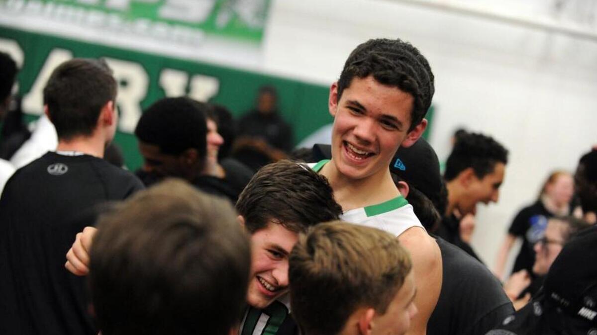 Fans swarmed the court after Cary beat New Hanover during the fourth round of the NCHSAA 4A boys basketball playoffs, which was played in Cary on Tuesday, March 1, 2016. Cary won 58-49 in overtime.