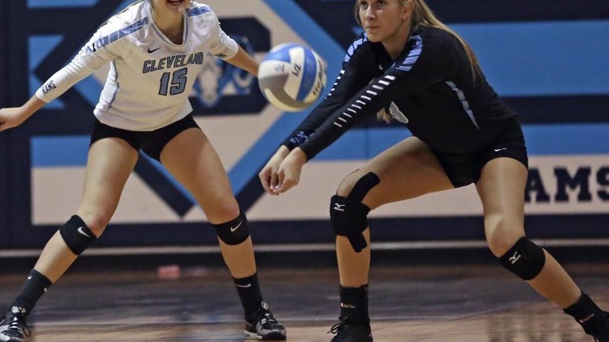 Cleveland's Taylor Thomas (3) returns a shot into the backcourt as teammate Bri Gross (15) backs up the play. Coverage from the 1st round of the NCHSAA volleyball tournament between the Corinth Holders Pirates and the Clayton High Comets played in, N.C. on Wednesday, October 21, 2015. Cleveland won the championship 3-1.