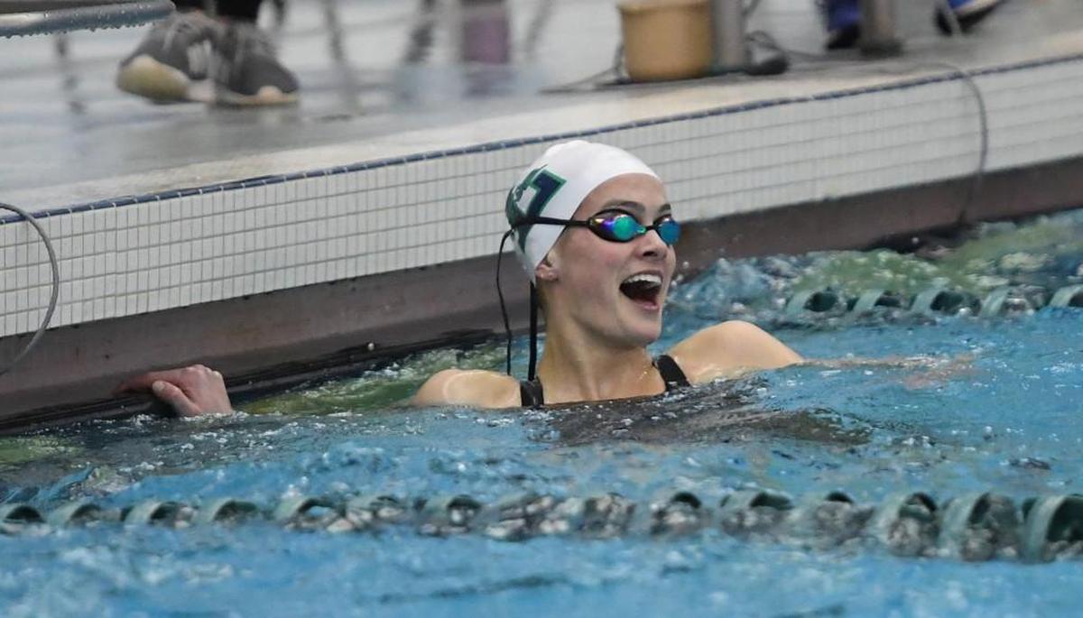 Grace Countie of Leesville Road celebrates at the end of the Women 50 Yard Freestyle race during the NCHSAA 4A Swimming Championships that took place at the Triangle Aquatic Center in Cary, N.C. on Saturday, February 10, 2018.
