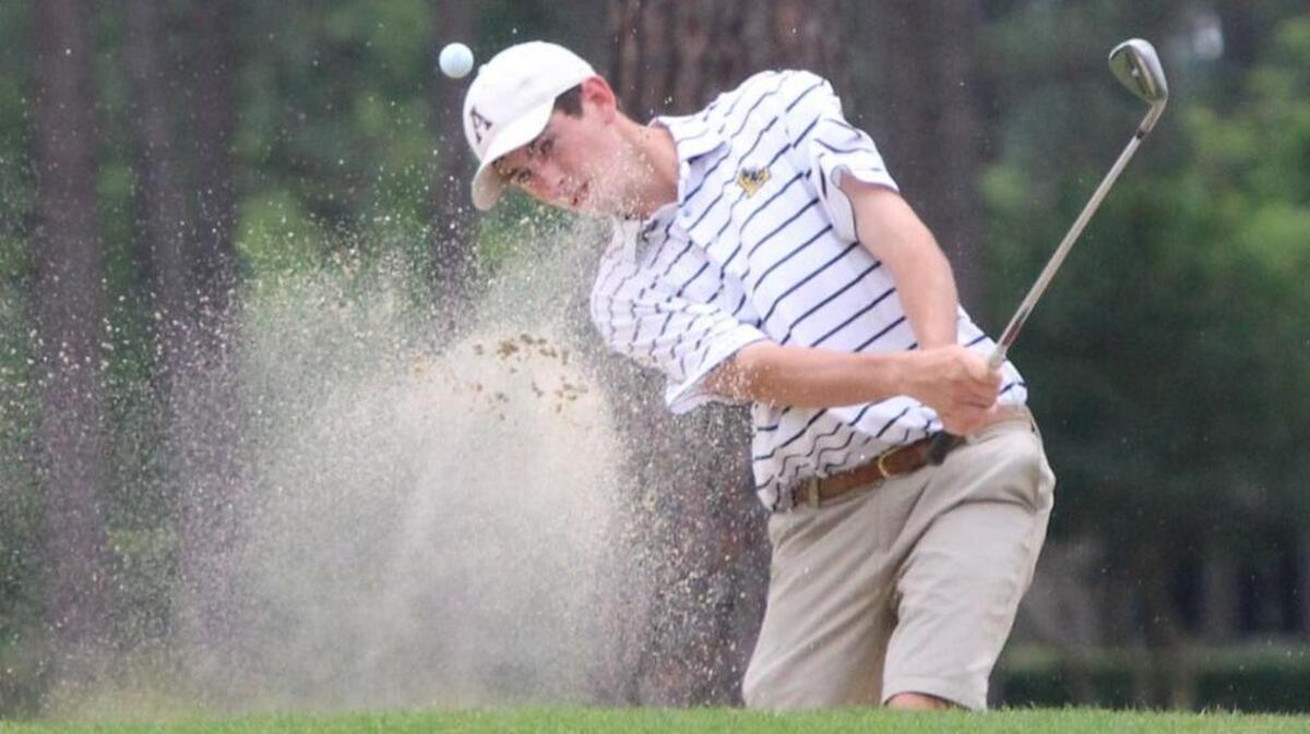 Lee County's Walter Brinker hits out of the sand and onto the No. 15 green on the first day of the boys' golf 3A state championships at the Country Club of Whispering Pines in Whispering Pines, N.C. on Monday, May 9, 2016.