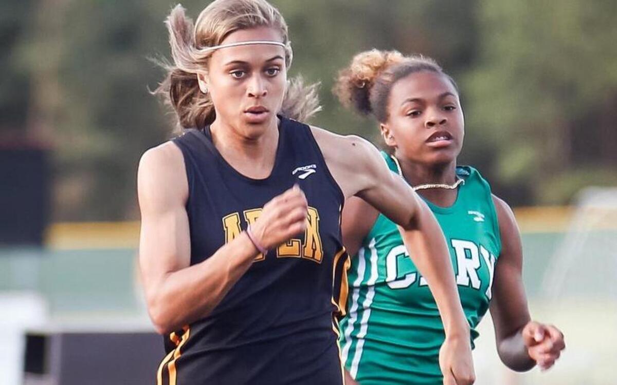 
Sydnei Murphy leads Cary's Charminique Hackney to win the 100 meter dash during the SWAC track and field championships at Green Hope on Tuesday, April 21, 2015.
