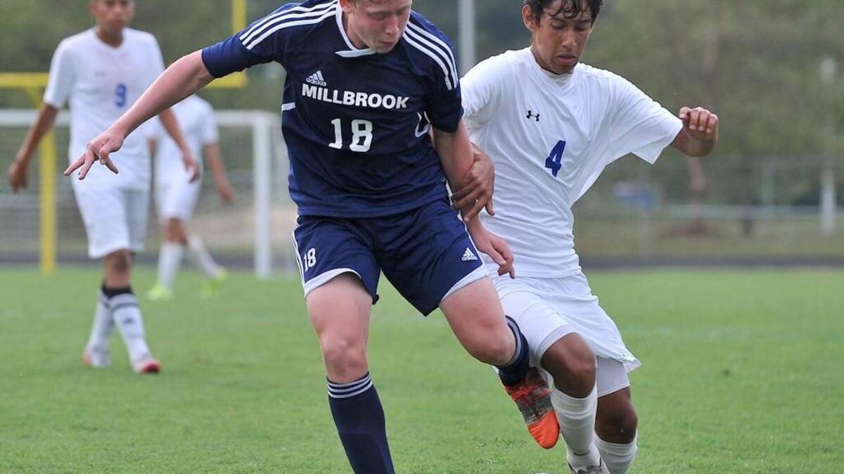 
Millbrook’s Kyle May (18) and East Wake's Steven Juarez-Reyes (4) battle for control of the ball. The East Wake Warriors took on the Millbrook Wildcats in a soccer game in Wendell, N.C. on August 26, 2015. Millbrook won 2-1.
