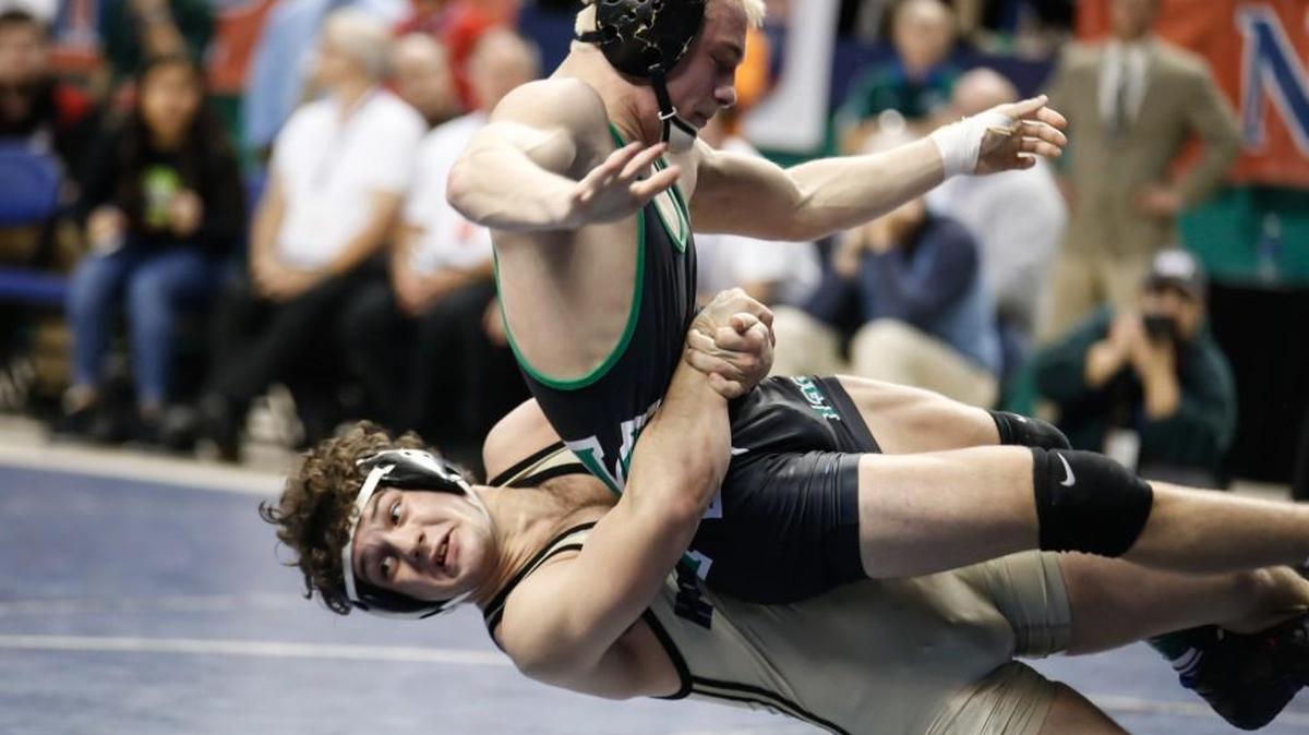 Holly Springs' Cam Devers, bottom, throws A.L. Brown's Nicholas Sexton, winning their 138-pound title match 1-0, during NCHSAA State Wrestling Championships in Greensboro on Saturday, February 20, 2016. The win was Holly Springs' first wrestling state championship.