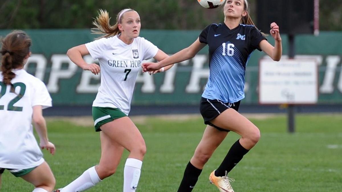 Panther Creek's Sydney Rucker (16) beats Green Hope's Grace Wagner (7) to the ball during the girls soccer game, which was played in Cary on Monday, March 14, 2016. Green Hope won 2-0 in a weather-shortened game.