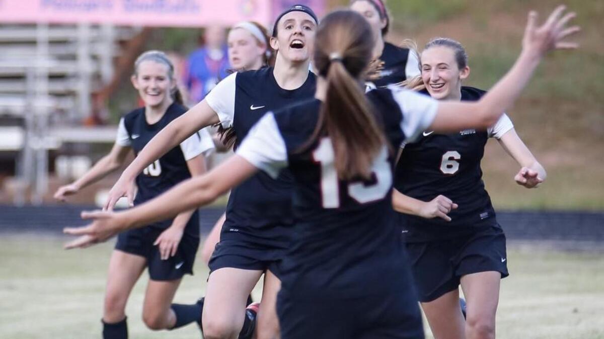 After scoring the first goal of the game, Middle Creek's Kylie McElroy runs with the rest of her teammates to celebrate with Mattie Murphy (13), who provided the assist, during Middle Creek's girls soccer game at Athens Drive on Tuesday, May 24, 2016. Middle Creek won the game 4-1.