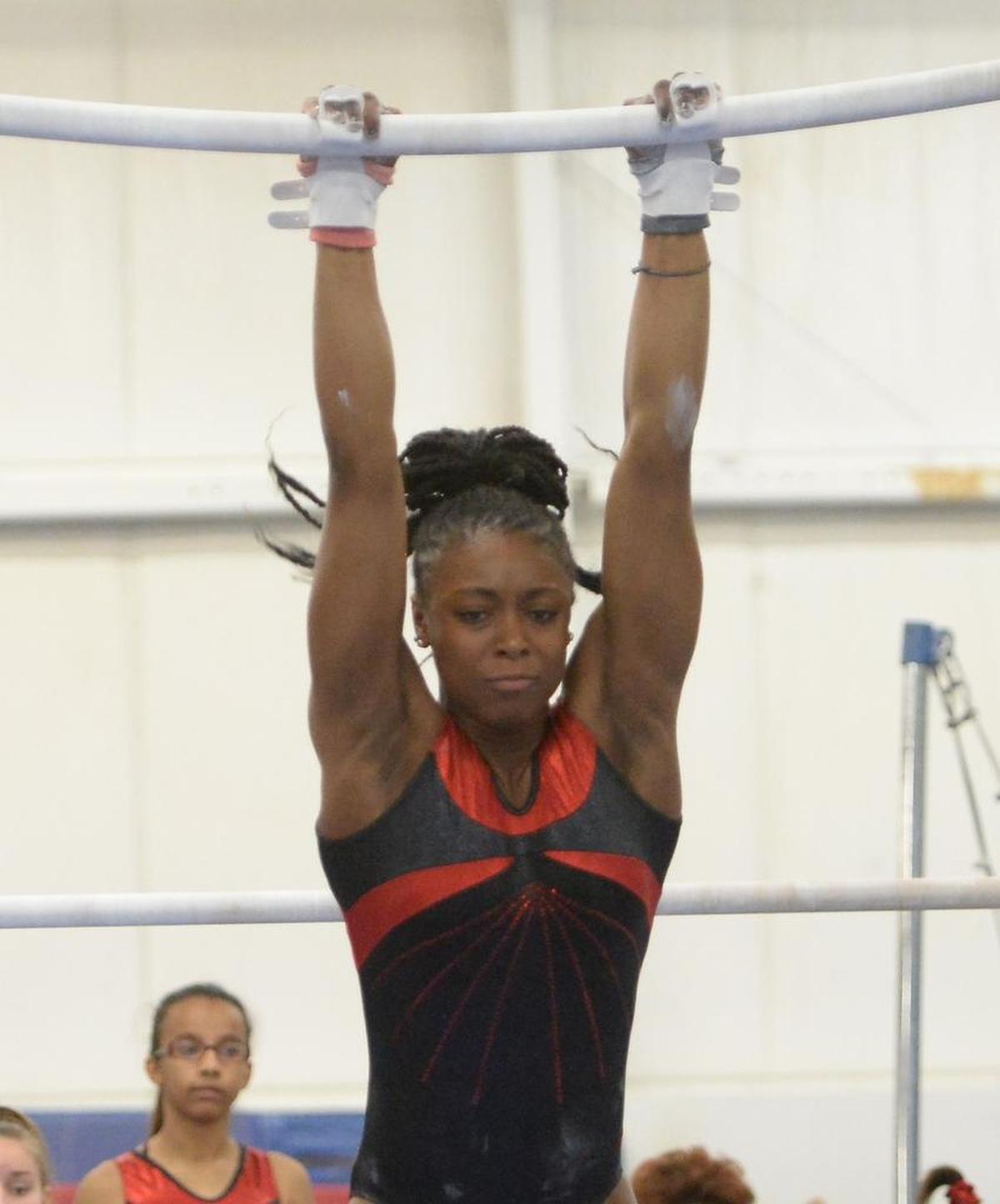 Nhyla Bryant of Rolesville performs in the uneven bars competition during the North Carolina High School State Gymnastics Championships that took place in Raleigh, N.C. on Saturday, January 21, 2017.