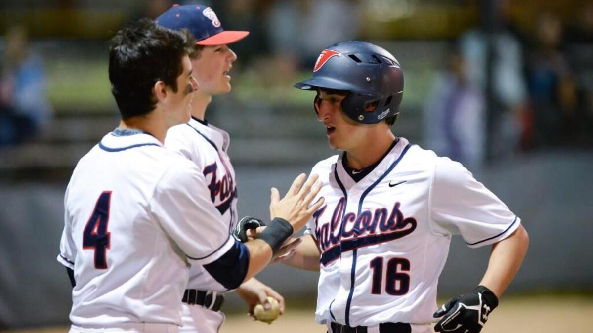 John Jung (16) of Jordan celebrates along his teammates after scoring for the Falcons. The Jordan Falcons played the East Chapel Hill Wildcats in a baseball game that took place in Durham, N.C. on Friday, April 15, 2016. Jordan won 4-1.