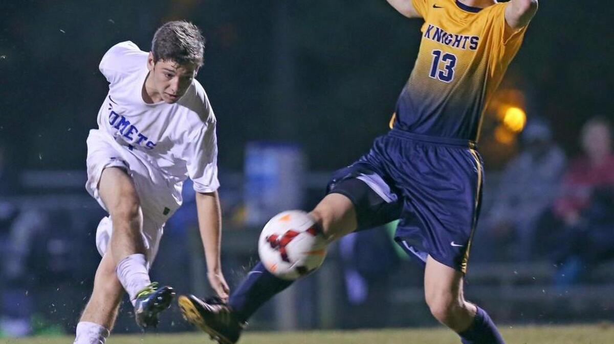 Clayton’s Dylan Sherron (17) sends a shot on goal as Northern Durham’s Finn Lorenz (13) defends.