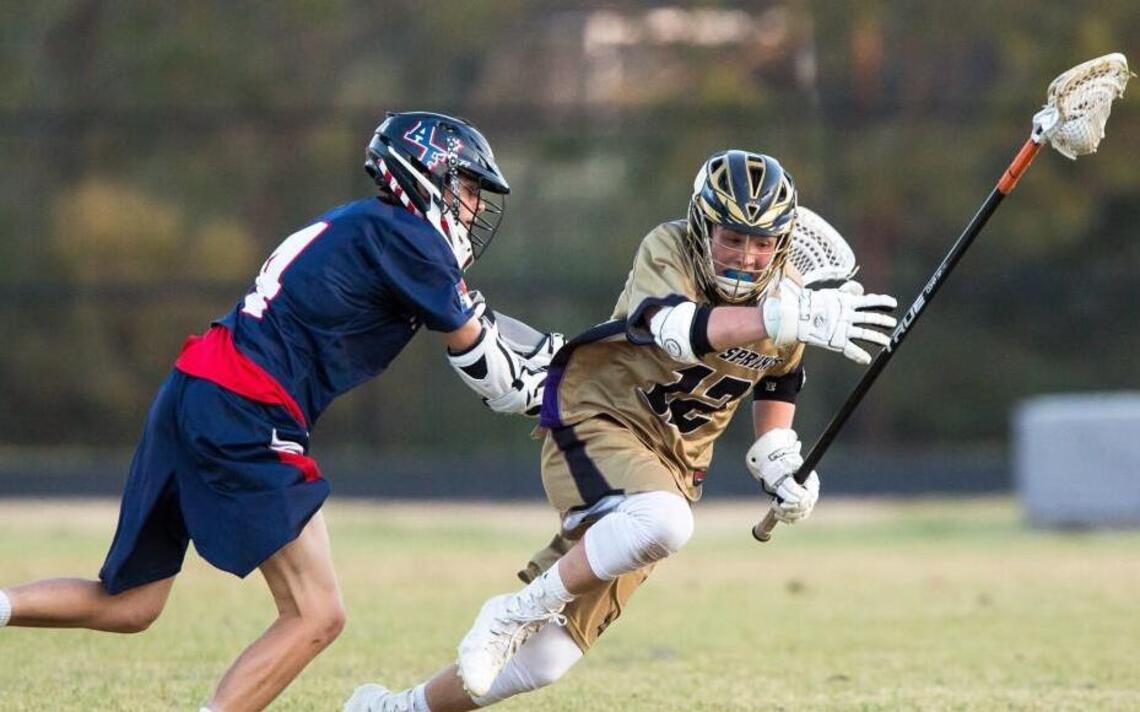 Holly Springs boys lacrosse rolls by Apex Friendship