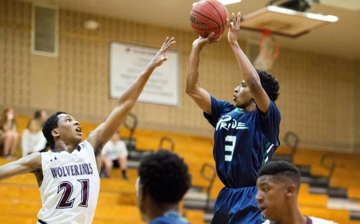 Leesville's Alex Hunter (3) shoots over Wakefield's Trae Smith (21) during Cap-8 matchup between Leesville Road and Wakefield that took place at Wakefield High School on January 13, 2017 in Raleigh, North Carolina. Leesville Road girls win in a thriller against Wakefield by the score of 47-45. Leesville Road boys dominate Wakefield boys by the score of 85-68.