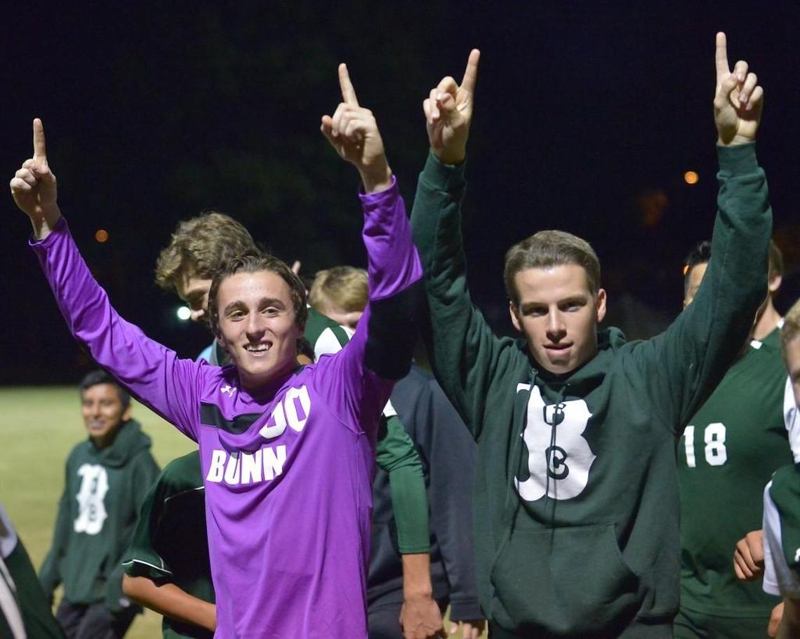 Bunn's Jake Moore (00) and John Stallings celebrate after their victory over N.C. Science and Math. The Bunn Wildcats took on the North Carolina School of Science & Math Unicorns in a soccer game in Durham, N.C. on October 24, 2016. Bunn wins 3-2.
