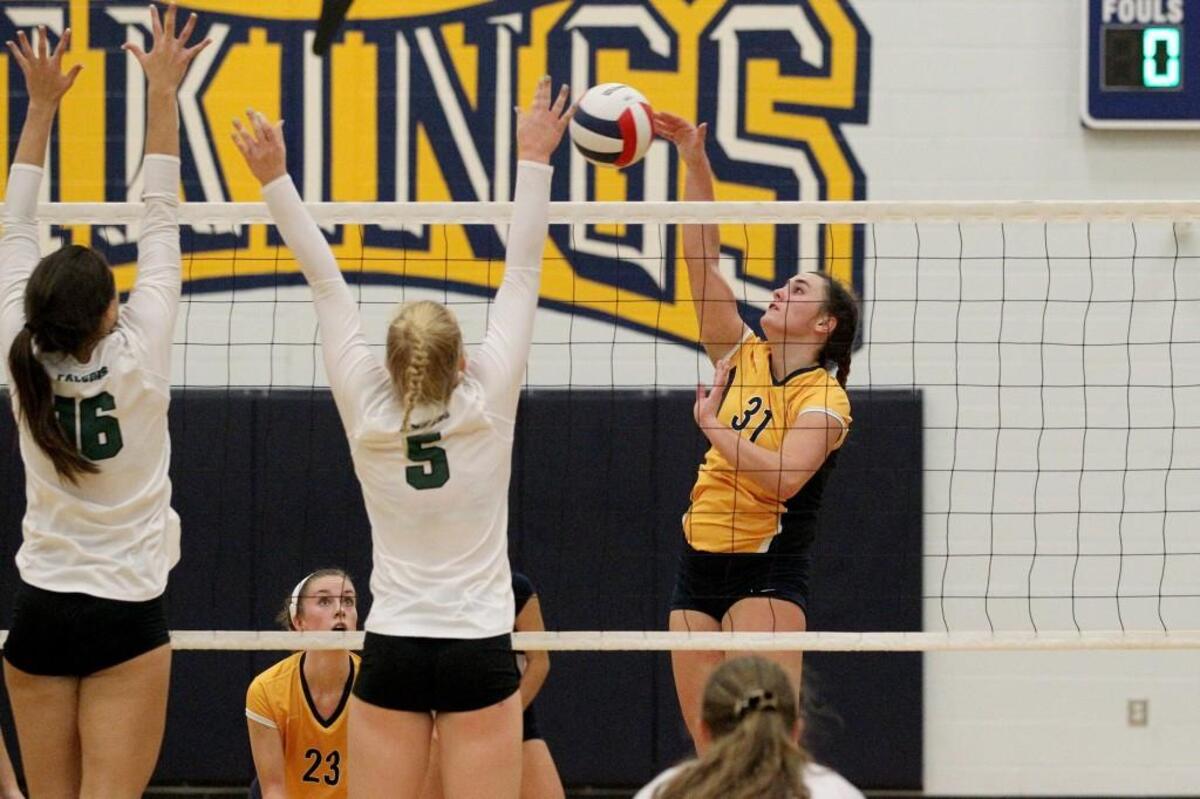 Green Hope's Alexis Engelbrecht (16) and Green Hope's Sydney Dowler (5) jump to block D.H. Conley's Alannah Thomas (31) spike attempt during the Green Hope High School girls volleyball game against D.H. Conley High School in Greenville, N.C. on Thursday, November 3, 2016.