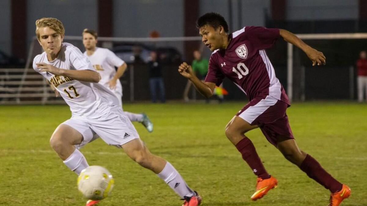 
Cedar Ridge’s Ivan Carbajal, right, and Chapel Hill’s Brendan Holly, left, both go after the ball. The Cedar Ridge Red Wolves and Chapel Hill Tigers soccer game in Chapel Hill, N.C. on Wednesday, October 14, 2015. Chapel Hill won 3-2.
