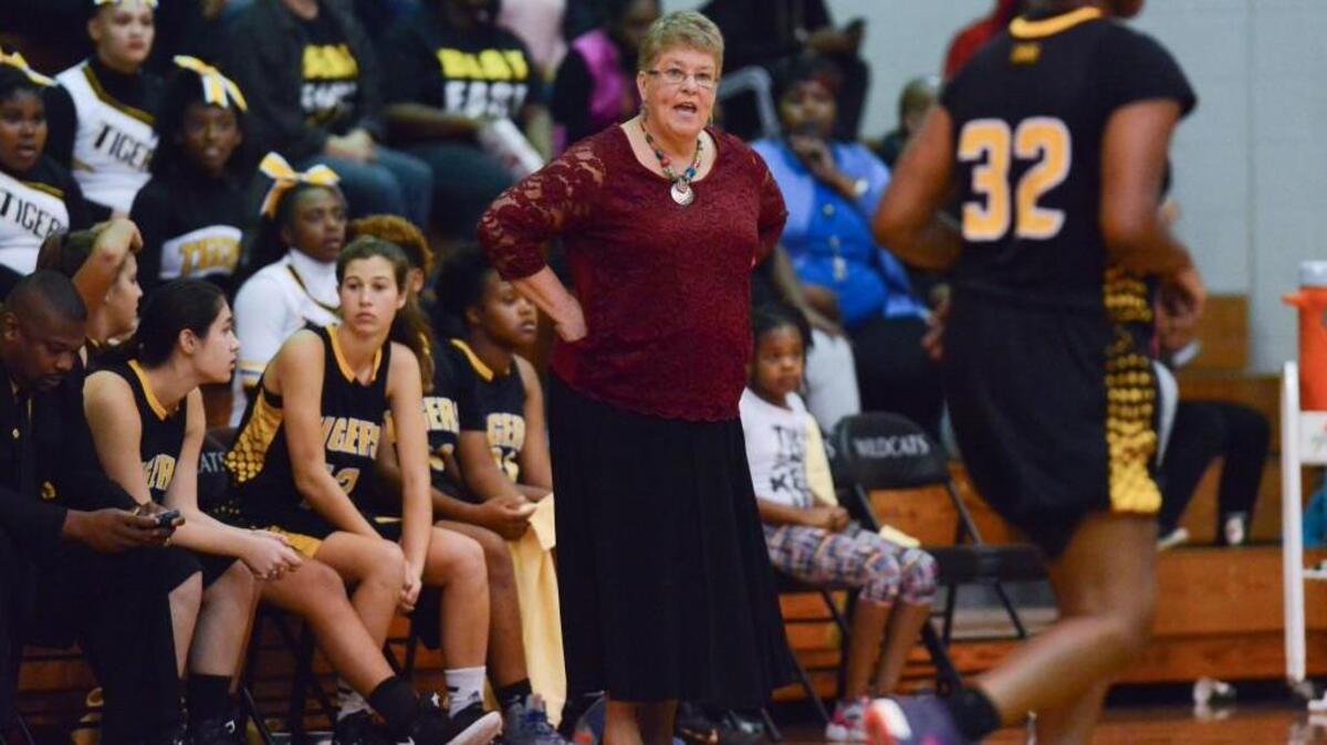 Sherry Norris, center, head coach of Chapel Hill instructs her players from the sideline. The East Chapel Hill Wildcats played the Chapel Hill Tigers in a women basketball game that took place in Chapel Hill, N.C. on Friday, November 18, 2016. Chapel Hill won 42-40 in overtime.