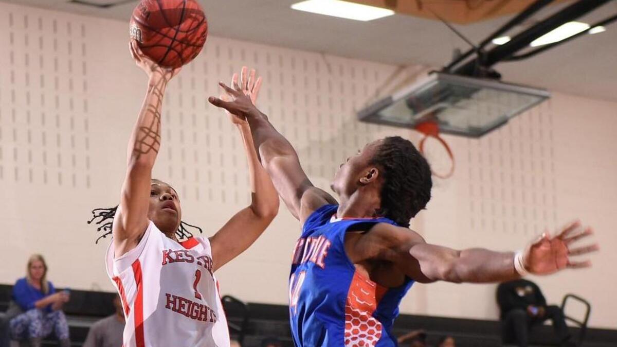 Kestrel's Javier Rogers (1) over Whiteville's Monchovia Gaffney (14) during the third round of the state playoffs at Panther Creek High School in Cary on Tuesday, February 28, 2017. Special to The Herald-Sun | John Joyner