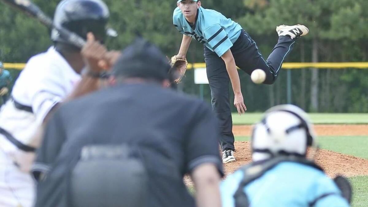 West Johnston’s Wade Eatmon (8) delivers a pitch in the bottom of the seventh as is able to shut down the Knights to clinch the victory and the outright conference championship.