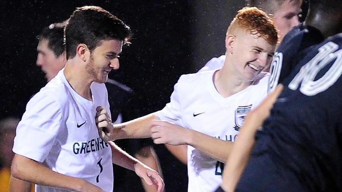 Green Hope celebrates a goal against Holly Springs during the first round NCHSAA soccer playoff game, which was played on Wednesday, November 4, 2015 in Cary. Green Hope won 3-2 in overtime.