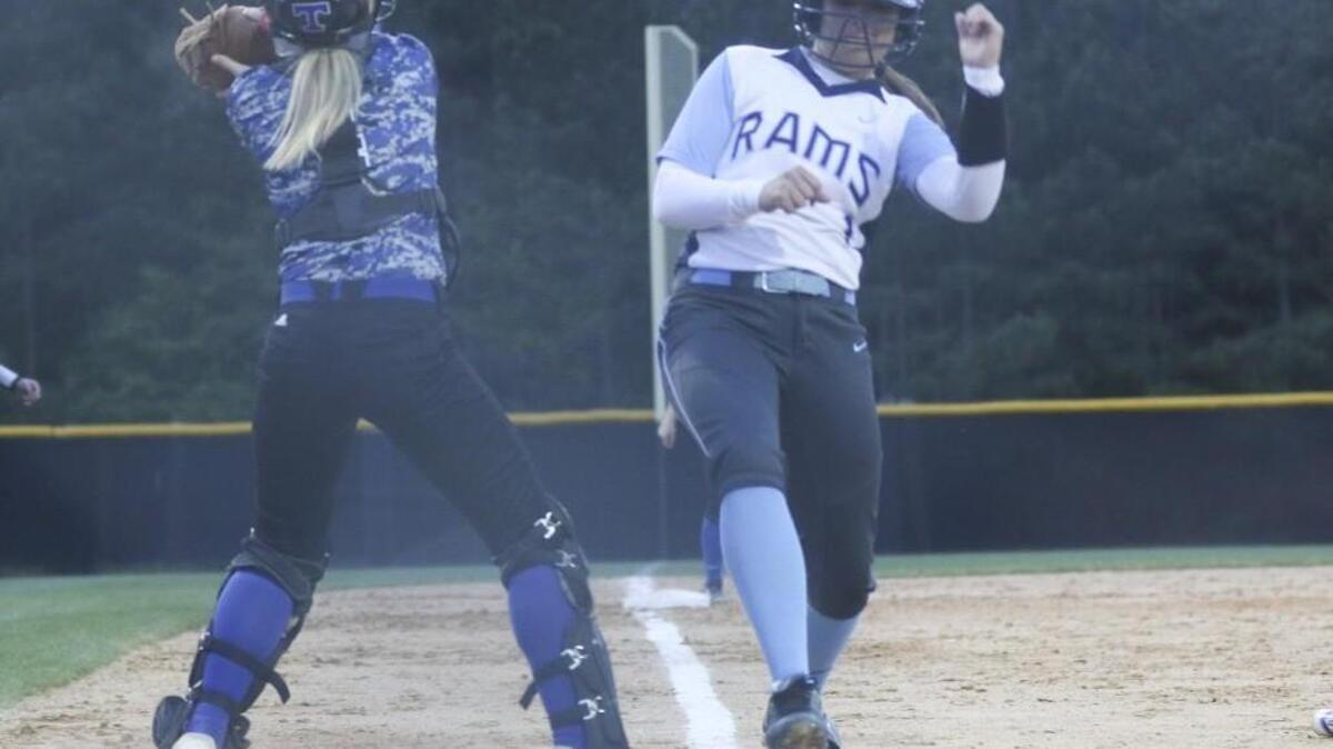 Cleveland's Anna Twisdale (1) steps on the plate as the throw comes home to clinch the game and the conference lead in the bottom of the 7th. Coverage from the girls prep softball game between the Cleveland Rams and the Triton Hawks played in Clayton, N.C. on Friday, April 15, 2016. Cleveland defeated Triton 4-3 to take over the Two Rivers Conference lead.