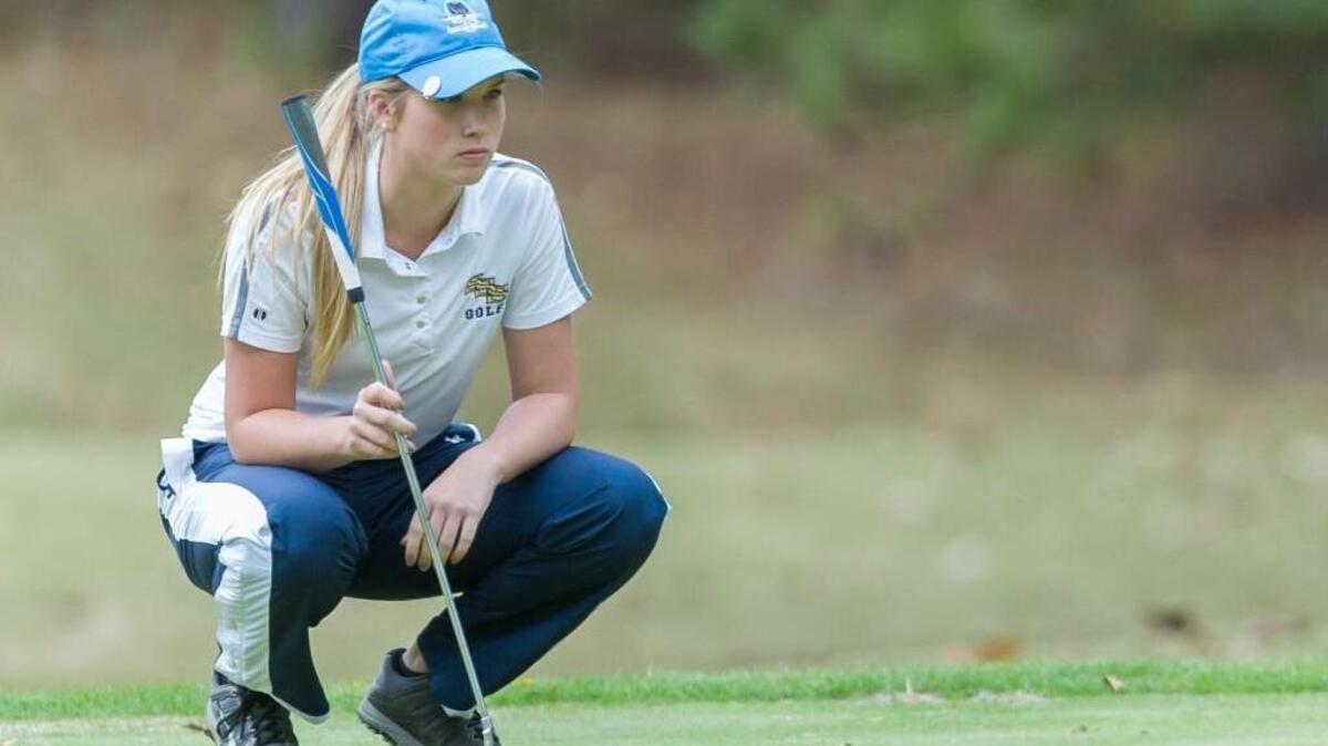 Parker Watson of Smithfield-Selma lines up a putt during at Foxfire Golf Course and Resort during the 2015 NCHSAA 3A Girls Golf State Championships.